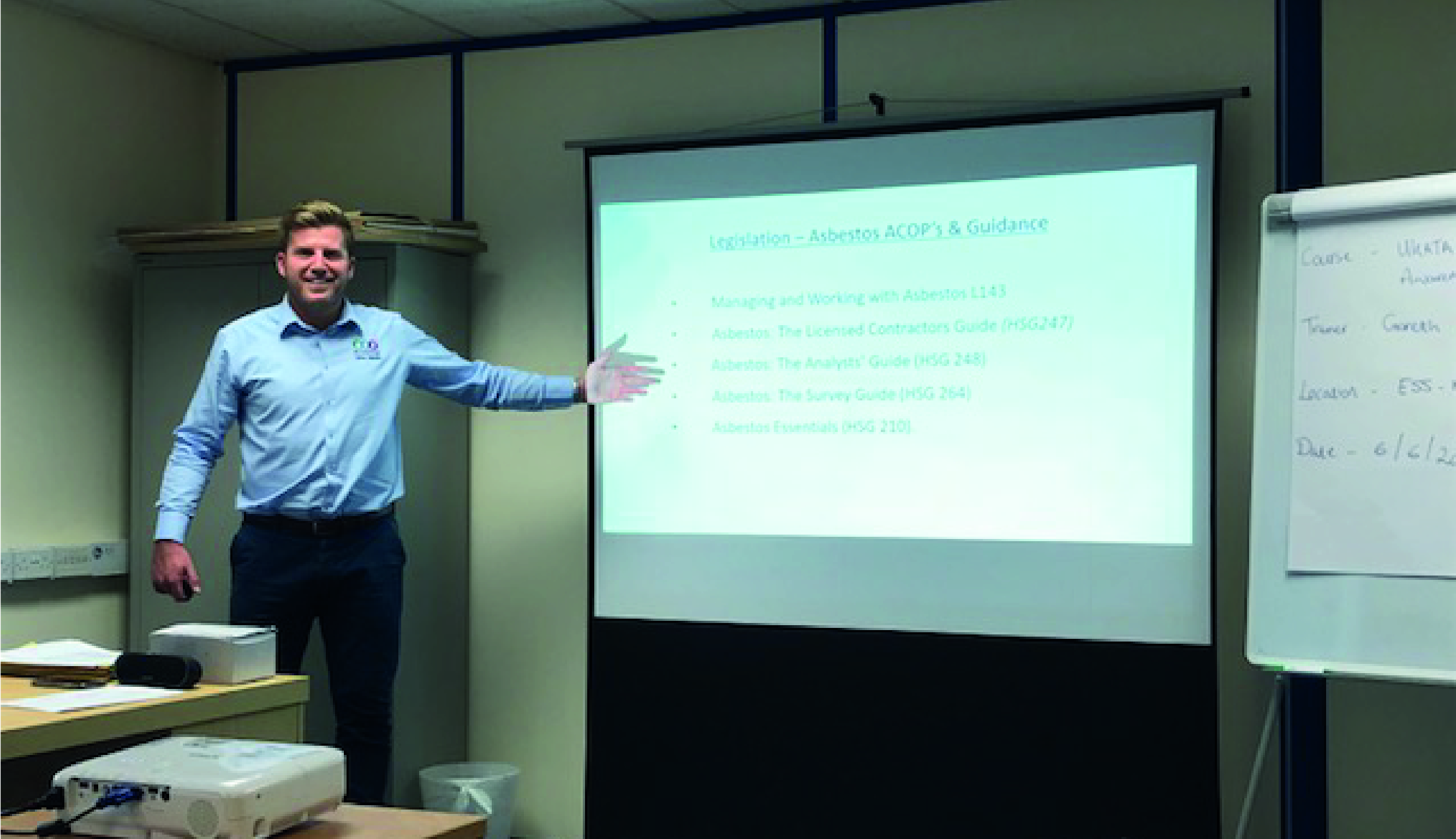 Image shows trainer giving asbestos presentation.