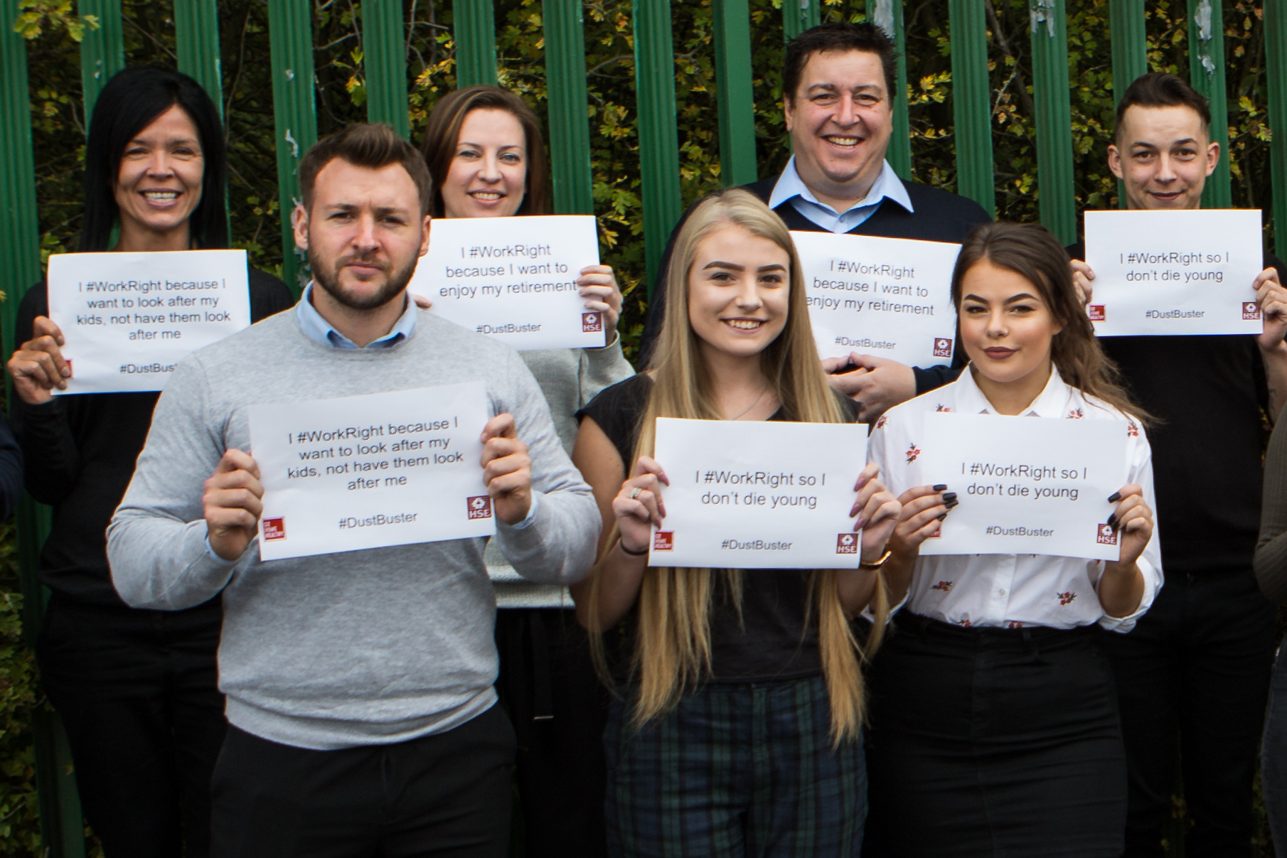 Image shows office workers stood with signs using the #workright and #dustbuster hashtags.