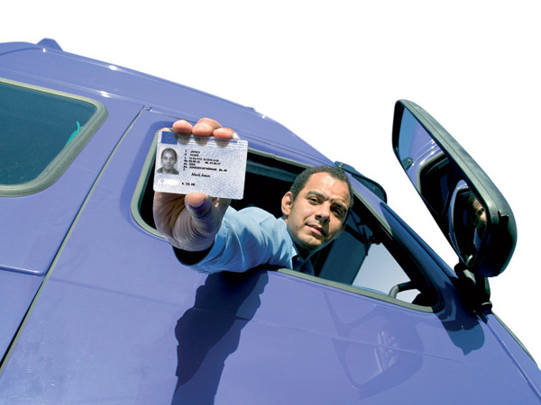 Image shows worker in vehicle with Driver CPC card.