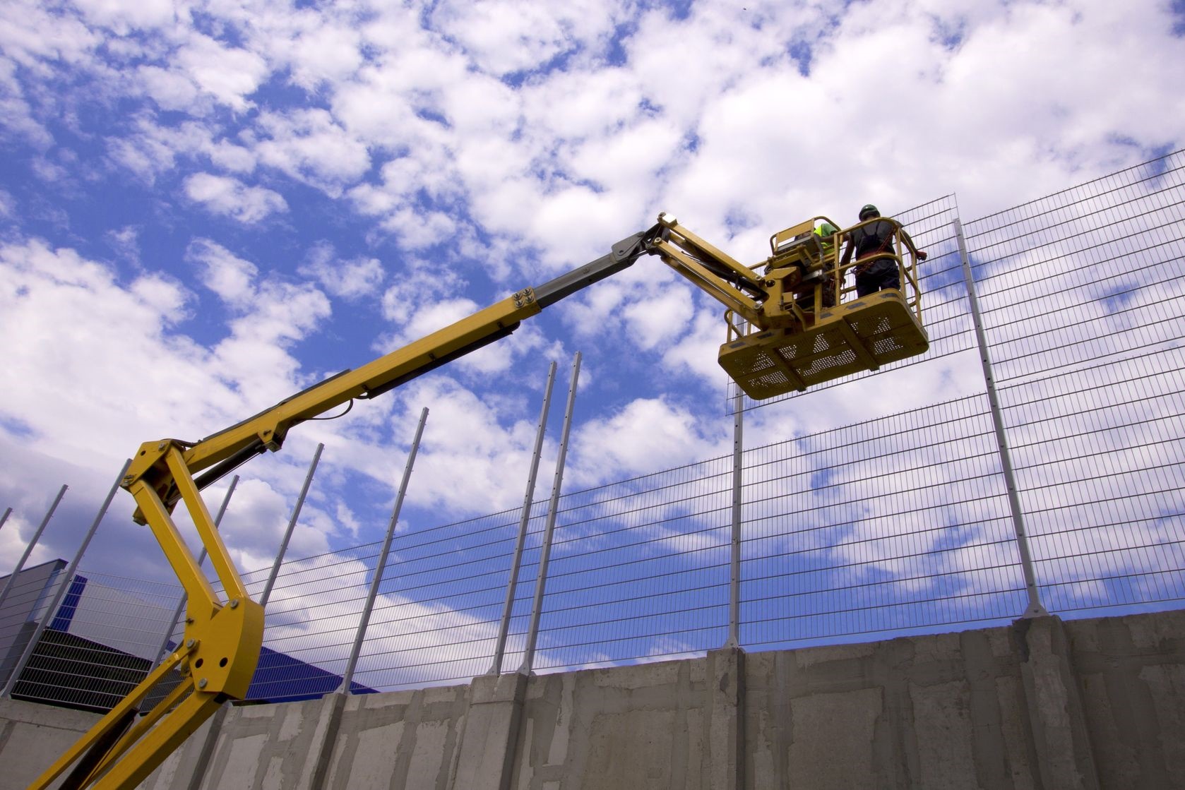 Image shows Cherry Picker vehicle with workers.