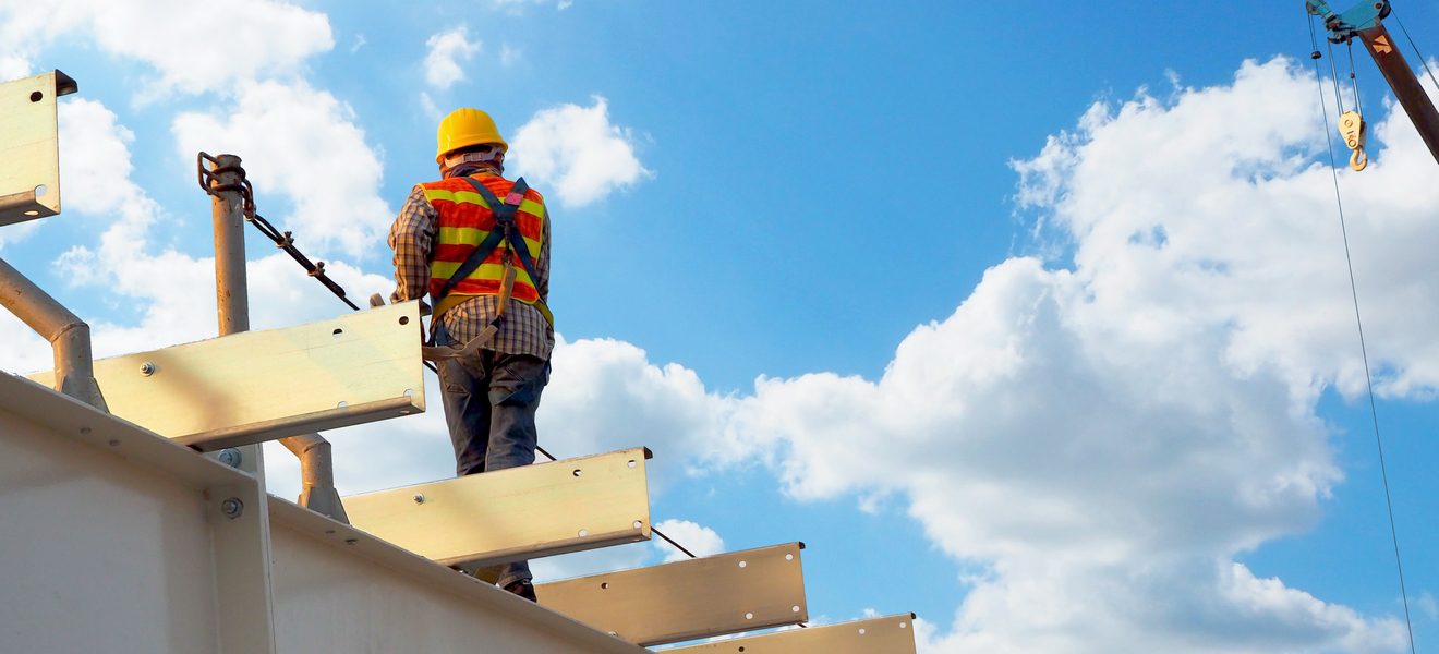 image shows a man working at height