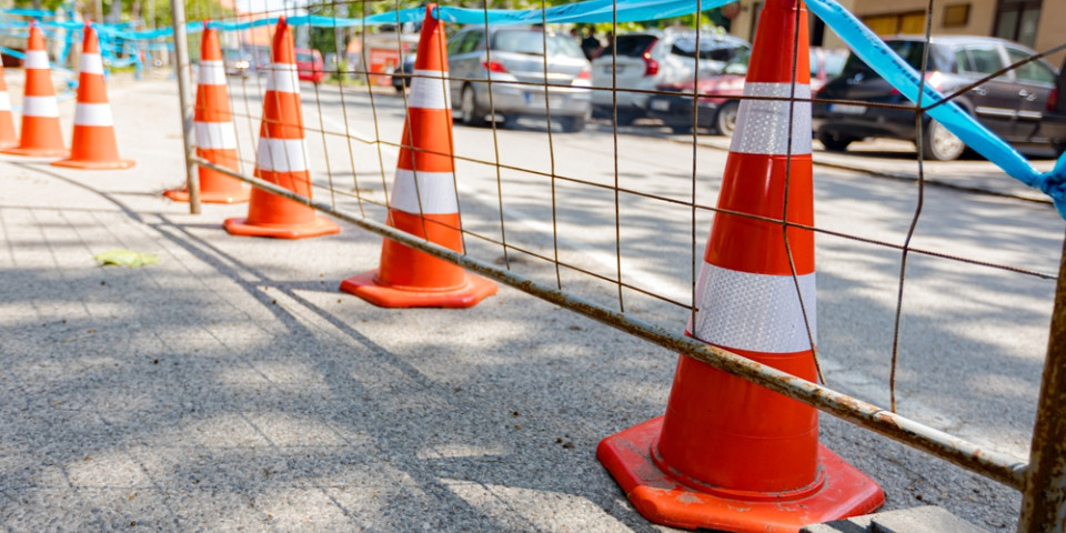 Temporary site barricade controlling access at a construction site