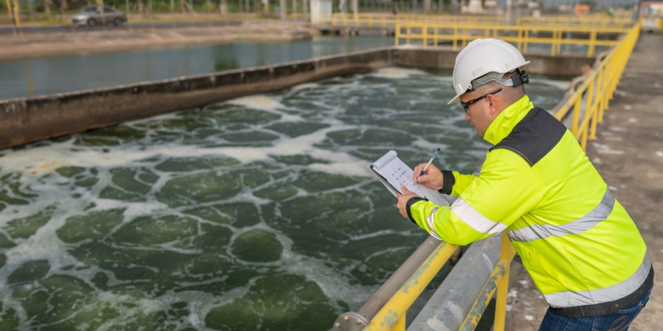 Utilities worker inspecting water treatment infrastructure demonstrating the type of environment where EUSR training, water hygiene competence and EUSR cards are required in the UK utilities sector.